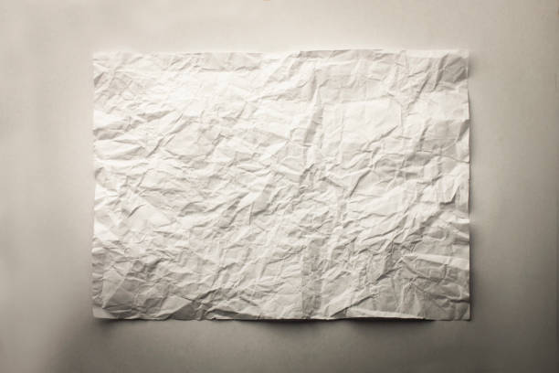 istock Crumpled piece of paper with shadows background 841851600