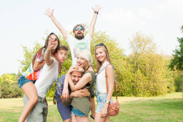 istock Group of friends having fun in a park 841851656