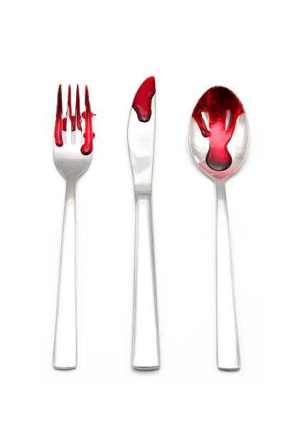 Cutlery knife and fork and spoon with blood stock photo