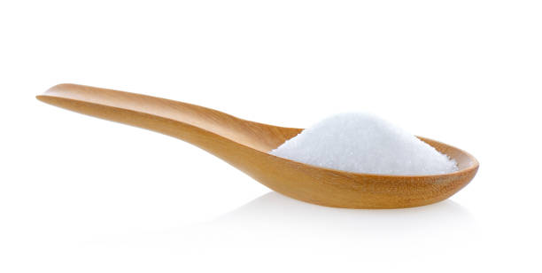istock Salt in wooden spoon on white background 841859394