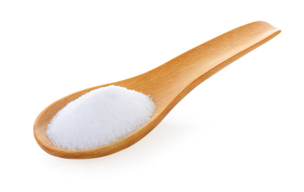 istock Salt in wooden spoon on white background 841859504