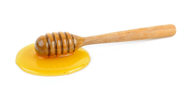 istock Wooden honey dipper with honey 841859596