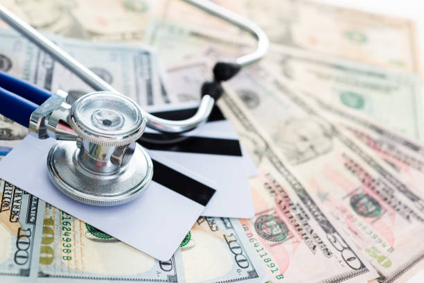 istock Stethoscope on credit cards and money 841862808