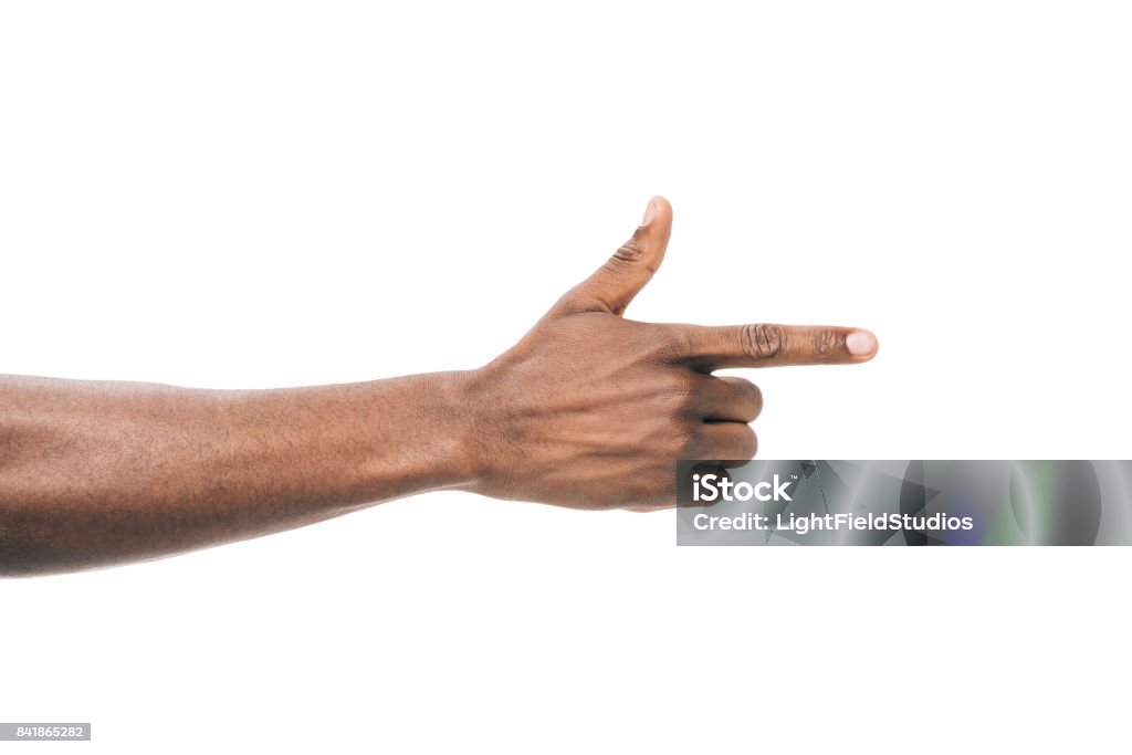 person pointing away with finger cropped shot of african american person pointing away with finger isolated on white Pointing Stock Photo