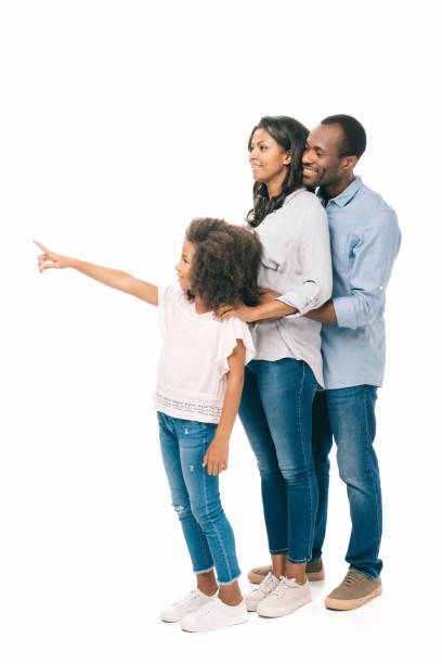 african american family pointing away smiling young  african american family pointing away with finger isolated on white the black womens expo stock pictures, royalty-free photos & images