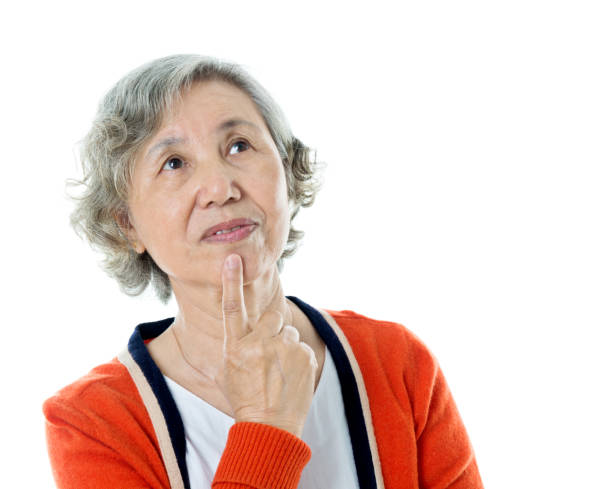 istock Senior woman putting finger on lips 841865946