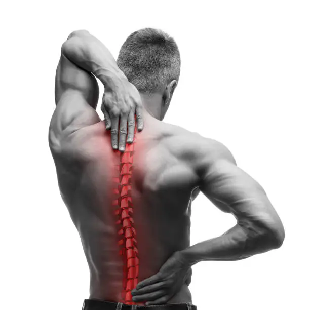 Spine pain, man with backache and ache in the neck, black and white photo with red backbone, isolated on white background