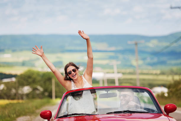 istock Couple in a convertible 841877760