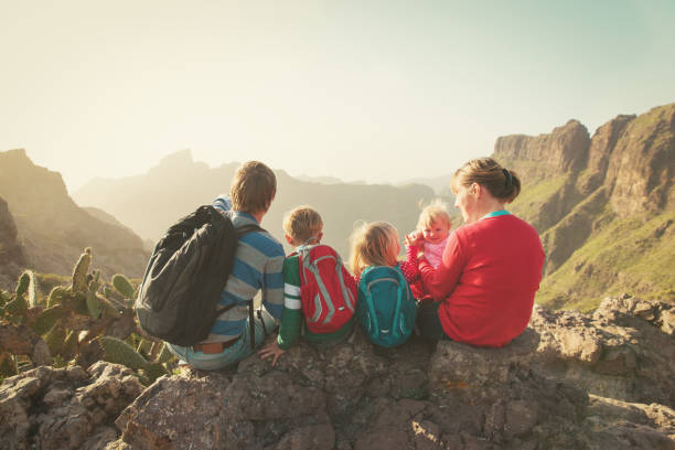 istock family with three kids hiking in mountains 841880376