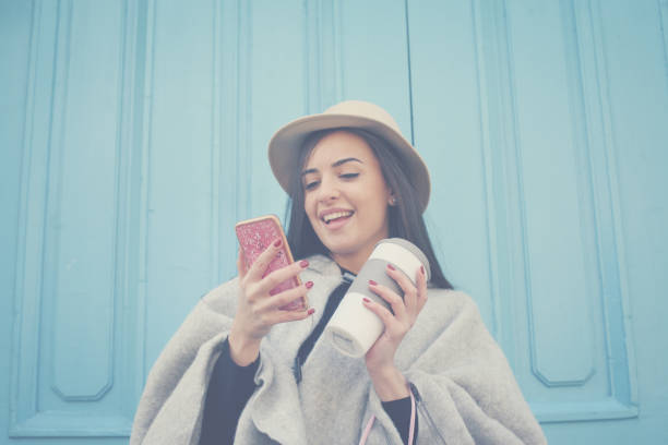 istock Young girl returns from  shopping and using smart phone. 841883024