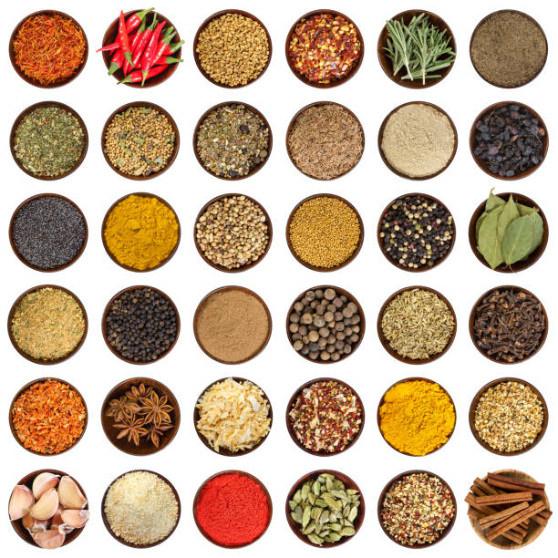 Set of different spices in wooden bowl. Top view. Set of different spices in wooden round bowl isolated on white background. Top view. barberry family photos stock pictures, royalty-free photos & images