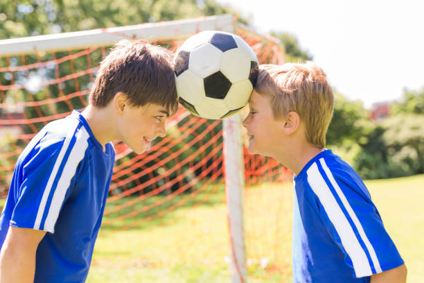 istock Two Young boy with soccer ball on a sport uniform 841883520