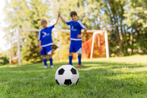 istock Two Young boy with soccer ball on a sport uniform 841884000