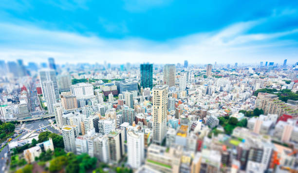 city skyline bird eye aerial view from tokyo tower under dramatic sunny and morning blue cloudy sky in Tokyo, Japan. Miniature Tilt-shift effect Business and culture concept - panoramic modern city skyline bird eye aerial view from tokyo tower under dramatic sunny and morning blue cloudy sky in Tokyo, Japan. Miniature Tilt-shift effect tilt shift stock pictures, royalty-free photos & images