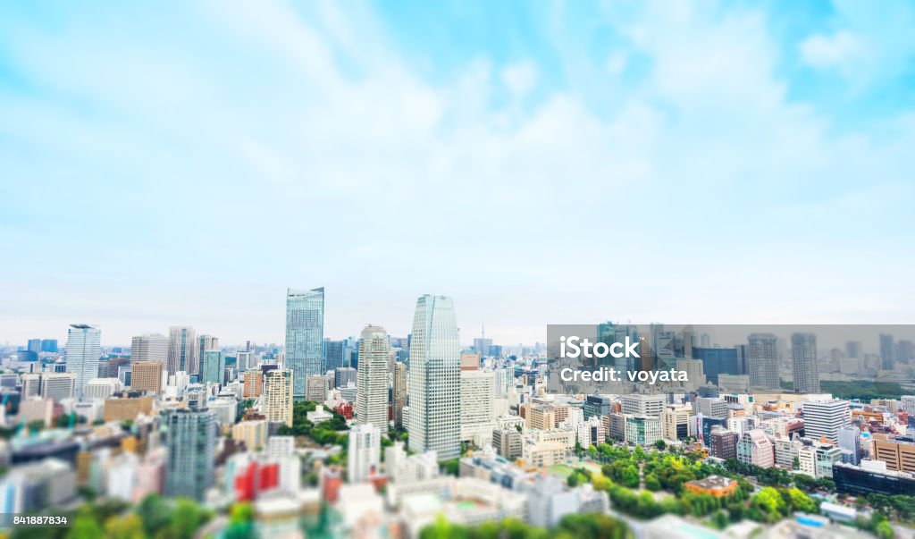 city skyline bird eye aerial view from tokyo tower under dramatic sunny and morning blue cloudy sky in Tokyo, Japan. Miniature Tilt-shift effect Business and culture concept - panoramic modern city skyline bird eye aerial view from tokyo tower under dramatic sunny and morning blue cloudy sky in Tokyo, Japan. Miniature Tilt-shift effect City Stock Photo