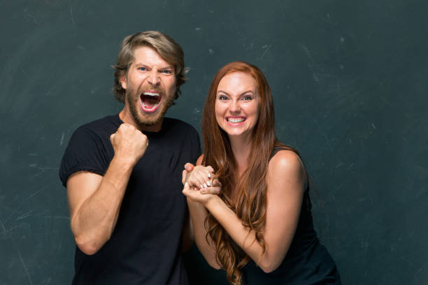 The love, family, sports, entretainment and happiness concept The love, family, sports, entretainment and happiness concept - a couple of fans with a variety of emotions football player girlfriend stock pictures, royalty-free photos & images