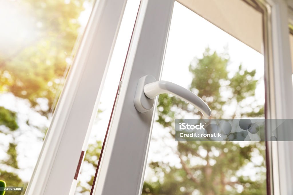 opened white plastic pvc window Window Stock Photo