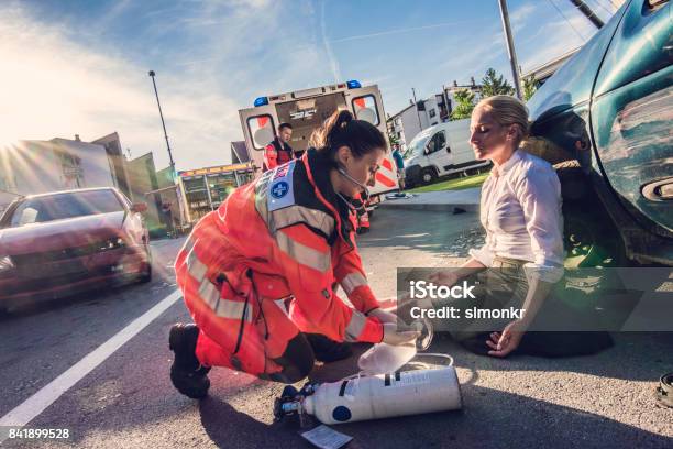 Paramedics Providing First Aid Stock Photo - Download Image Now - Car Accident, Paramedic, Ambulance