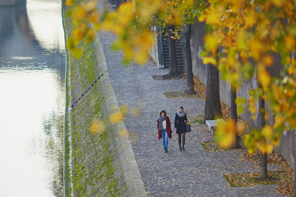 istock Two young girls walking together in Paris 841904948