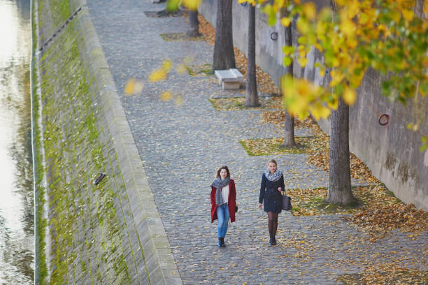 istock Two young girls walking together in Paris 841905500