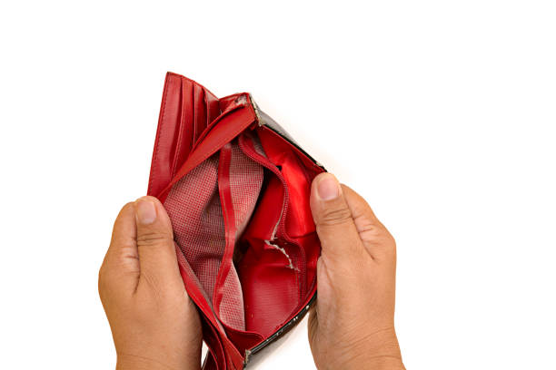 istock Financial difficulties concept,woman hands holding old red wallet isolated on white background 841908960