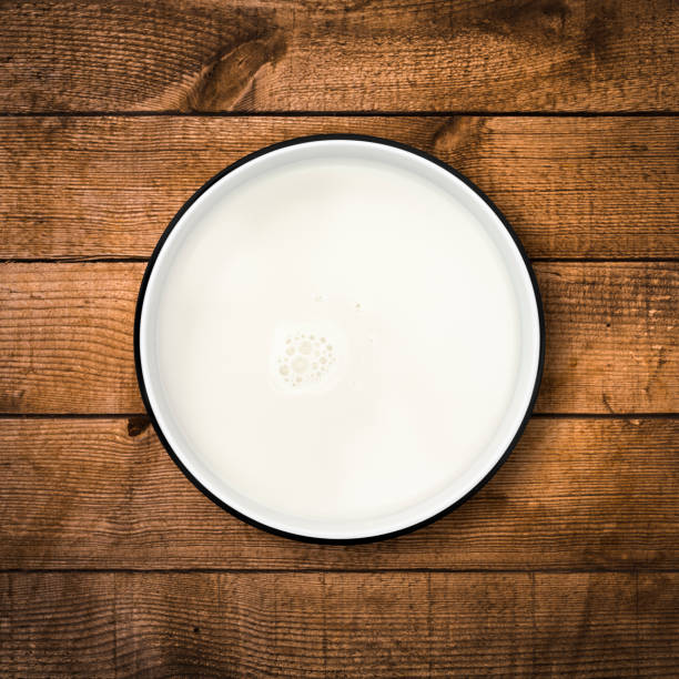 istock Milk bowl on wood background from directly above. Clipping path. 841909574