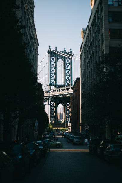 istock Manhattan Bridge and Empire State seen between buildings in Dumbo 841912598