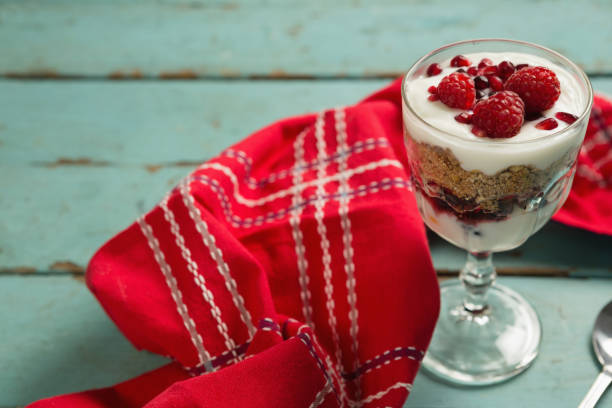 istock Cup of yogurt with raspberry and pomegranate 841912658