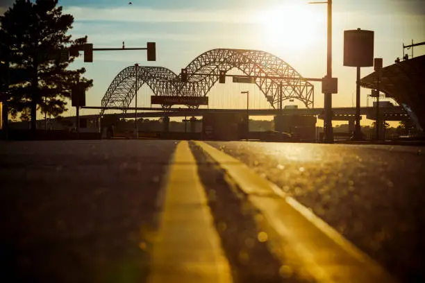 Memphis, TN, USA - June 20, 2017: View of Hernando de Soto Interstate 40 Bridge between downtown Memphis and Arkansas from Poplar Avenue at dusk near Mud Island