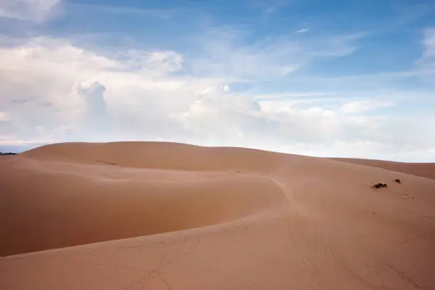 Desert landscape dunes in the afternoon with blue skies white clouds and nobody around, Vietnam asia.