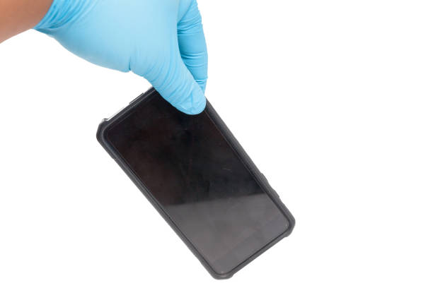 istock hand in blue glove holding phone 841924080