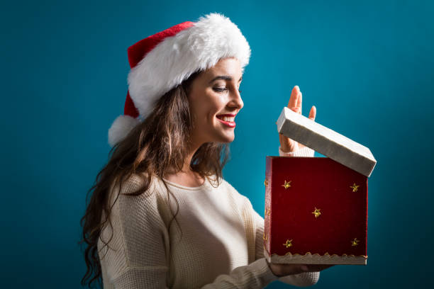 istock Happy young woman with Christmas present box 841924468