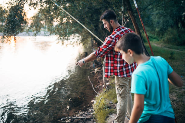 istock First fishing with my dad 841924606
