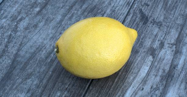 istock Fresh lemon on a wooden background. 841928008