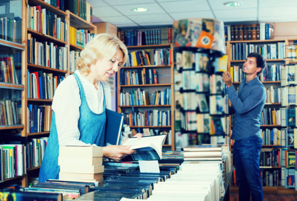 istock Woman searching for new book 841930622