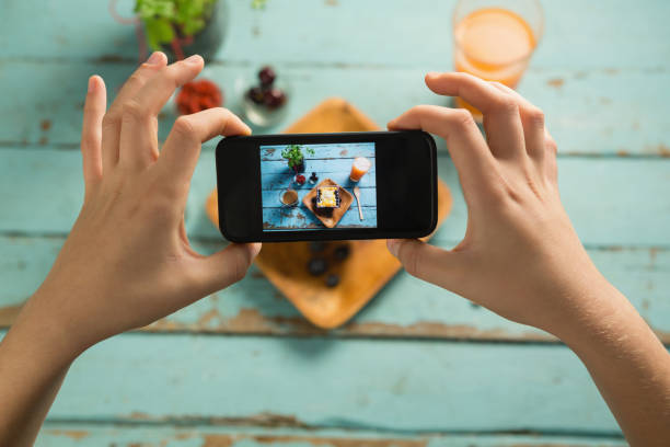 istock Hands taking photo of breakfast with mobile phone 841930882