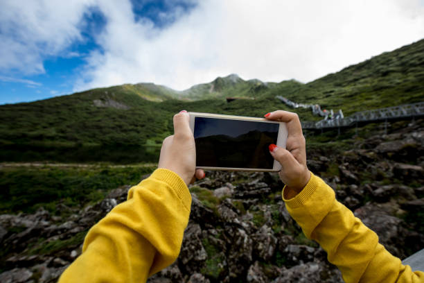 istock taking photo with smart phone 841934384