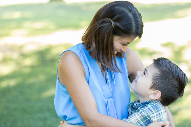 istock Caring mom and her adorable son in the park 841934738