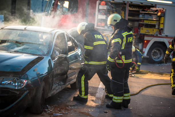 istock Firefighters trying to open car door 841935408