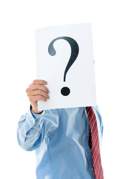 istock Confused businessman holding question mark 841940864