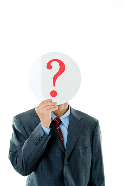 istock Confused businessman holding question mark 841940944