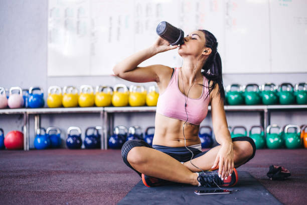 Sip of fresh water after great workout Sip of fresh water after great workout sport drink stock pictures, royalty-free photos & images