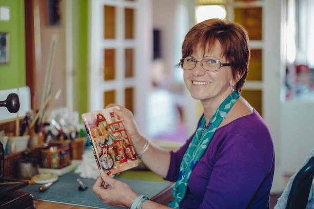 portrait of a bookbinder - independence business women manual worker imagens e fotografias de stock