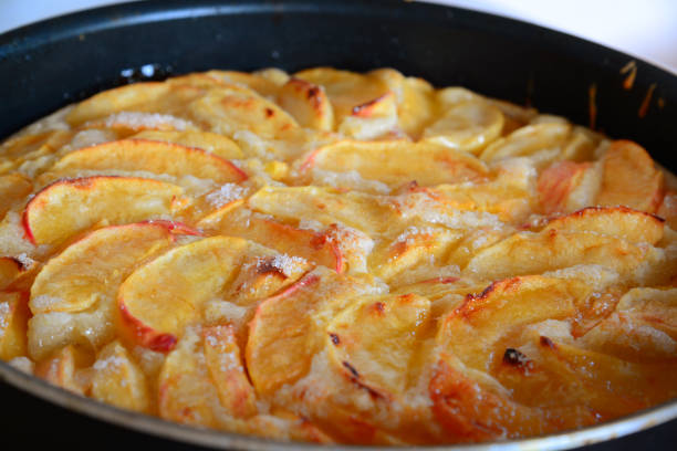 istock Baked charlotte with red apples in a baking dish 841944596