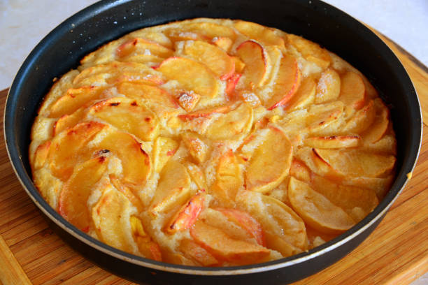 istock Baked charlotte with red apples in a baking dish 841944632