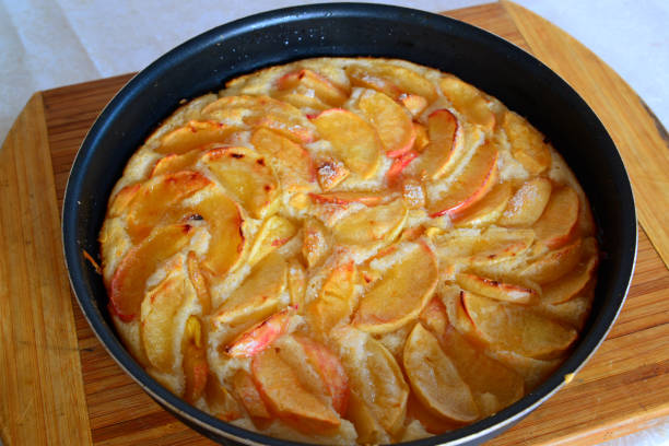 istock Baked charlotte with red apples in a baking dish 841944660