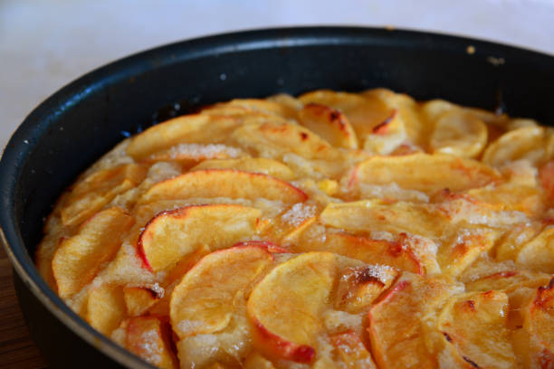 istock Baked charlotte with red apples in a baking dish. Fragment 841944692
