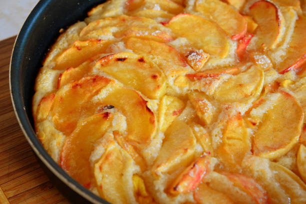 istock Baked charlotte with red apples in a baking dish. Fragment 841944728