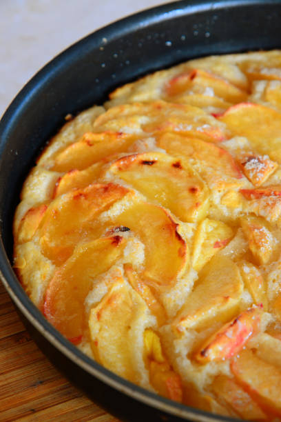 istock Baked charlotte with red apples in a baking dish. Fragment 841945064