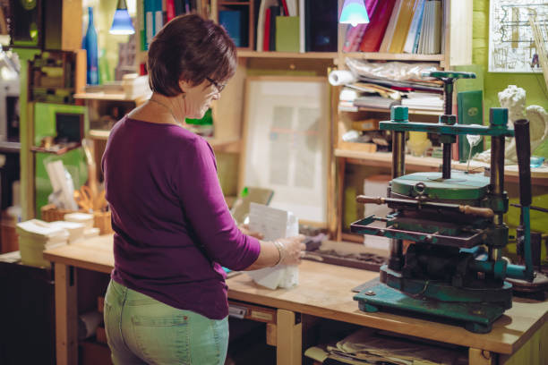portrait of a bookbinder - independence business women manual worker imagens e fotografias de stock